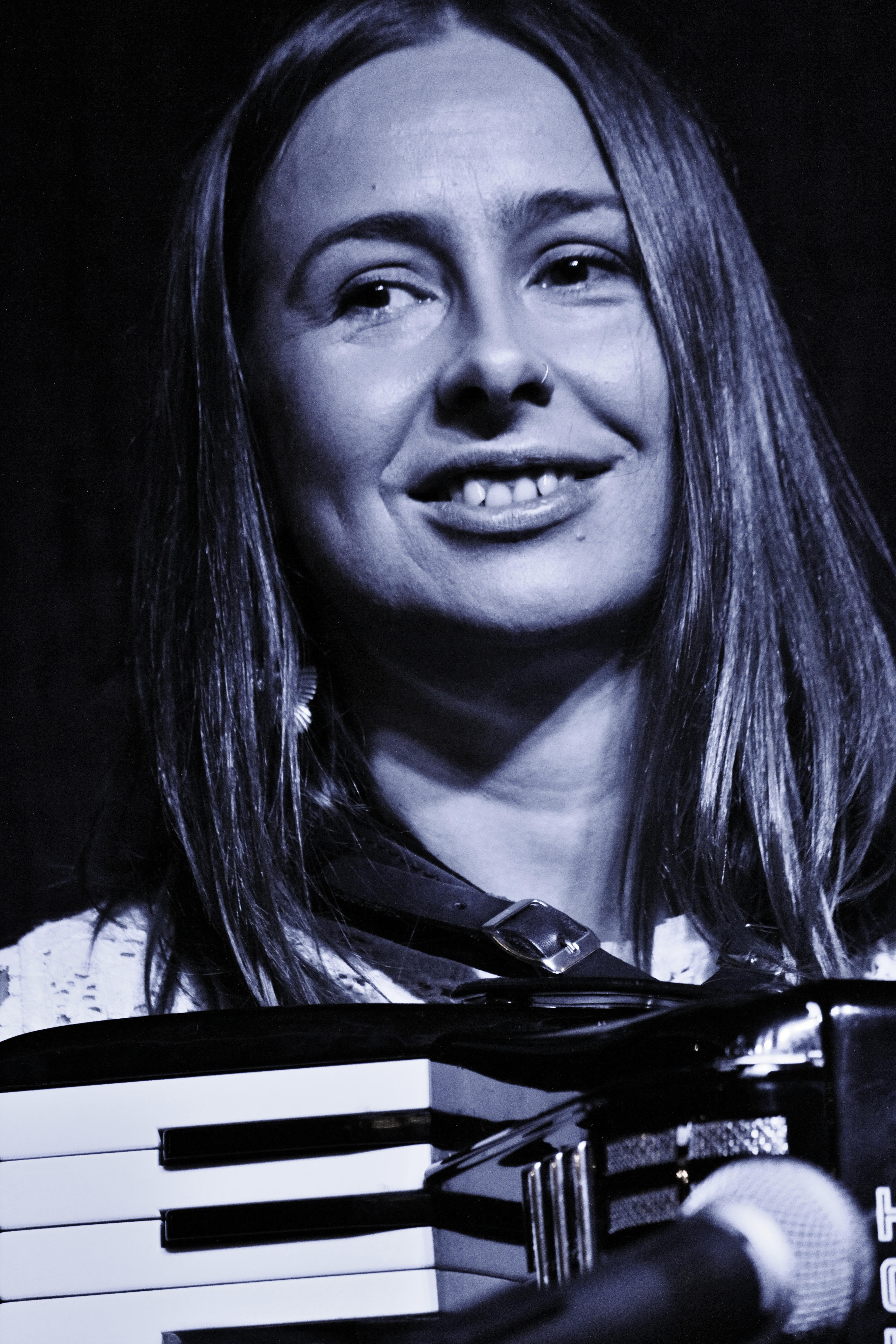 Image of Helen Maher, with accordion. Photo by Adrian Wharton.